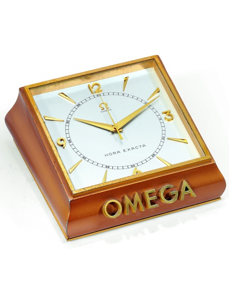 HORA EXACTA.Omega, Bienne, Hora Exacta, No. 1125402, Ref. 5008. Made in 1954..Very fine and rare, bronzed, 100-hour, Hora Exacta Deluxe, center-seconds, window.presentation, keyless, chronometer table clock with high precision caliber. Accompanied.by the 