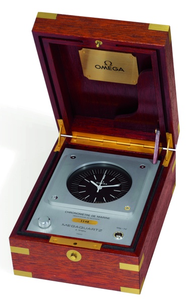 MARINE CHRONOMETER _.MEGAQUARTZ Omega, No. 1148, movement No. 45924898, Ref. PE 5806. Sold on January 17, 1983..Fine, mahogany-cased quartz deck chronometer with center seconds. This chronometer.is sold with a Certificate of Authenticity, and a 2-year Ome