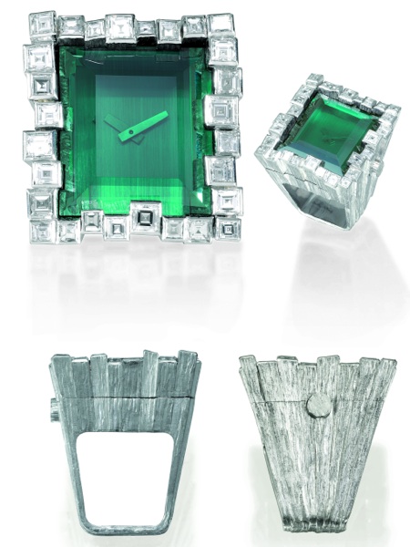 URSULA ANDRESS RING WATCH Omega, No. 32331944, Ref. AT 651.002 / Grima 6765. Sold on February 4, 1972..Very fine, unusual, rectangular, diamond, platinum, and tourmaline ring watch by.Andrew Grima. This watch is sold with a box, Certificate of Authenticit