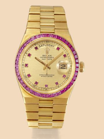 Ref. 19158, Yellow Gold and Ruby Oysterquartz.Day Date.Rolex, Oysterquartz, Day-Date, Superlative.Chronometer, Officially Certified, case No. 7257744, Ref..19158. Made in 1978..Very Rare and fine, tonneau-shaped, water-resistant, center.seconds, ruby set 
