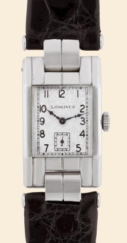 White Gold.Longines, No. 4857506. Made in the 1930s..Fine and rare, rectangular curved, 18K white gold mid-sized wristwatch with a Longines steel buckle.