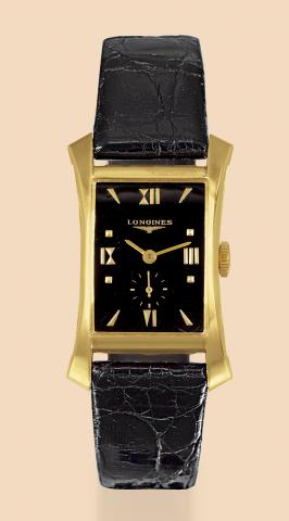 Longines, case No. A74486. Made in the 1940s..Fine and rare, rectangular curved and flared, 14K yellow gold wristwatch with gold-plated Longines buckle..Accompanied by a box and certificate..To be sold without reserve