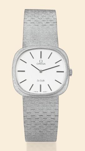 White Gold De Ville.Omega, De Ville.No. 33879101, Ref. 8302..Made circa 1971..Fine, 18K white gold, cushion-shaped.wristwatch with integral 18K white.gold textured bracelet.