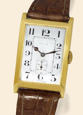 Yellow Gold Ref. 1442.Rolex, Geneve, Prima, Ref. 1442, No. 3039. Made in the 1940s..Fine, rectangular, 14K yellow gold wristwatch with a gold-plated Rolex buckle.