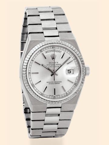 Oyster Quartz - Day-Date.Rolex, Oyster Quartz Day-Date, Superlative.Chronometer Officially Certified, Ref. 19019..Made in 1978..Fine, center seconds, water-resistant, 18K white gold quartz.wristwatch with day and date and an integral 18K white gold.link b