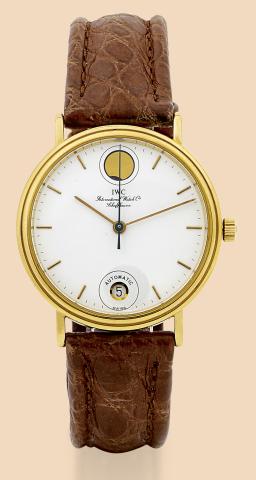 Moon Phases.International Watch Co., Schaffhausen.Automatic, Ref. 3512. Made in the 1980s..Fine and rare, center seconds, self-winding, water-resistant.18K yellow gold wristwatch with date, moon phases and an.IWC buckle.