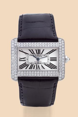Tank Divan.Cartier, Tank Divan, Ref. 2626. Production.of this model started in 2002..Fine and unusual, horizontal rectangular and curved, center.seconds, water-resistant, 18K white gold and diamond-set.wristwatch with an 18K white gold Cartier buckle. Acc