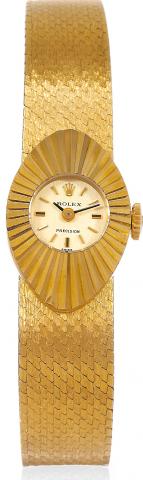 Orchid.Rolex, Orchid, Precision, Ref. 2000..Made in the 1960s..Fine, oval, 18K yellow gold lady's wristwatch.with an 18K yellow gold Rolex mesh.bracelet. Case featuring a double bottomed.back for insertion of the bracelet.
