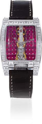 Golden Bridge Haute Joaillerie Rubies.Corum, Swiss, No. 1749921, Ref. 113.856.69. Made in 2007..Extremely fine and equally rare, large, 18K white gold, curved tonneau-shaped wristwatch with visible Golden Bridge.movement and set with 166 diamonds weighing