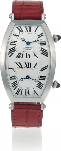 Two Time Zones.Cartier, Paris, No. 090, Ref. 2806H. Made in the 1990s..Very fine and rare, large, tonneau-shaped, curved, water-resistant, two time zone, 18K white gold wristwatch with two.independent mechanical movements and an 18K white gold Cartier dep