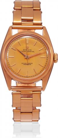 Rolex, Oyster Perpetual, Chronometer Officially.Certified, movement No 29318, Ref. 5009. Made in.the 1950s..Fine, center-seconds, self-winding, water-resistant, pink gold.and steel wristwatch with a pink gilt expanding riveted Oyster.bracelet with a gold-