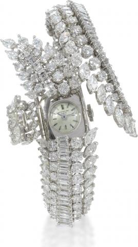 Diamond Bracelet.Patek Philippe, Geneve, No. 1101790, case No. 2609751, Ref. 3100-32. Made in 1965, sold on July 14, 1971..A magnificent and elegant and possibly unique lady's platinum and diamond bracelet with concealed watch, set with a.total of 33.02 c