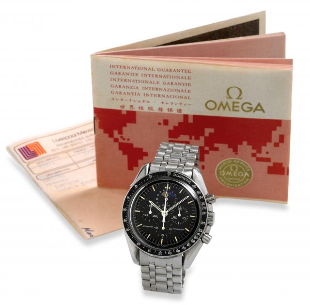 Speedymoon.Omega, Speedmaster Professional, No. 47132956, Ref. ST 345.0809. Made in 1985..Fine and rare, asymmetric, astronomic, water-resistant, stainless steel wristwatch with round button chronograph, date, moon phases.registers, black bezel with tacho
