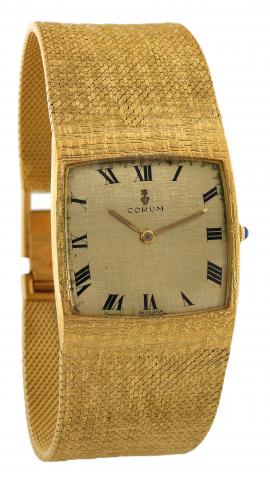 Yellow Gold Buckingham.Corum, Ref. 8521. Made in the 1980s..Fine, cushion-shaped, 18K yellowgoldwristwatchwith awide integrated.18K yellow gold textured Corum bracelet. Accompanied.by a fitted box.