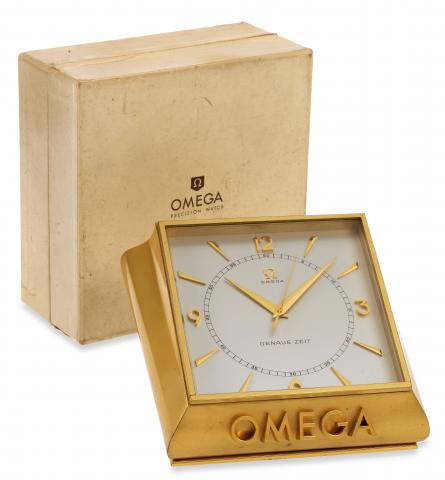 Omega, Bienne, Genaue Zeit,No. 716237, Ref. 5008..Made in 1954..Very fine and rare, bronzed, 100-hour, Genaue Zeit.Deluxe, center-seconds, window presentation, keyless, chronometer.table clock with high precision caliber. Accompanied by.the original fitte