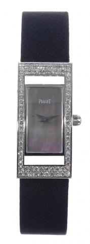 Piaget, Joaillerie, case No..852771, Ref. 54025. Made circa.2002..Very fine, elegant, rectangular, curved, 18K.white gold and diamond lady