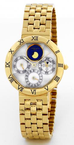 Gold Perpetual Calendar.Gerald Genta, Geneve, Quartz Perpetual Calendar,.Ref. G 3090.7. Made in the 1990's..Fine, astronomic, water-resistant, 18K yellow gold wristwatch with.perpetual calendar, leap year indicator and moon phases, on 18K.yellow gold Gera