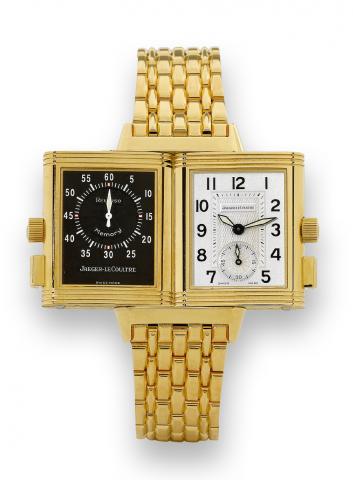 Yellow Gold.Jaeger-LeCoultre, Reverso Memory, Ref..255.1.82. Made in the 1990s..Fine, rectangular, 18K yellow gold reversible wristwatch with.two dials, permanent minute register with fly-back mechanism.50-hour autonomy and an 18K yellow gold Jaeger-LeCou