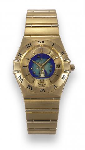 No. 26.Omega, Constellation No. 26, movement No. 81122804, Ref. BC 368.1201. Made in a numbered edition.in 1995..Very fine and rare, tonneau-shaped, center seconds, self-winding, 18K yellow gold wristwatch with polychrome cloisonn_.enamel Observatory dial