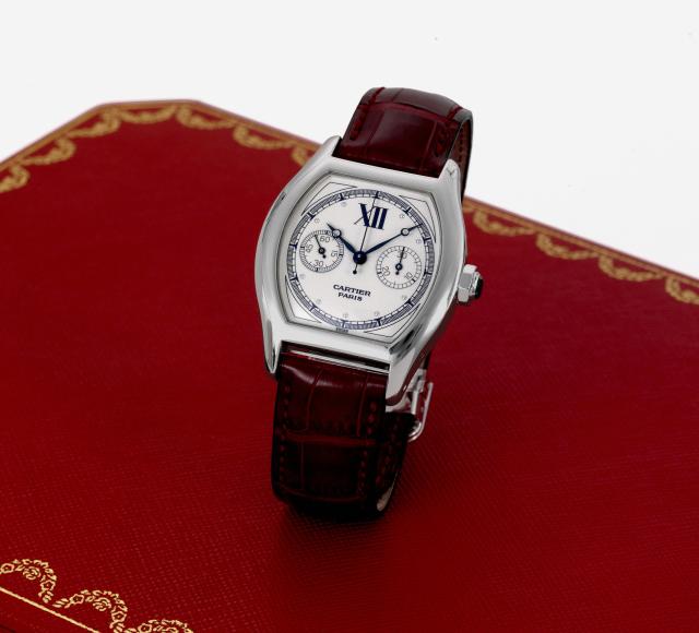 White Gold Tortue Monopoussoir.Cartier, Paris, Collection Priv_e - Tortue Chronographe, No. 0078CE, Ref. 2396E. Made circa 2005..Very fine, tonneau-shaped, water resistant, 18K white gold wristwatch with coaxial single button chronograph, register and an 