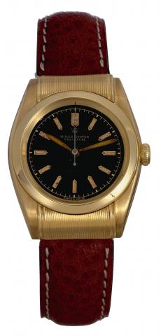 Ref. 6065, Rigid Hooded.Rolex, Oyster Perpetual, Chronometre, Ref. 6065. Made circa 1950..Very fine and rare, tonneau shaped, water-resistant, self-winding, center seconds, 18K yellow gold wristwatch.