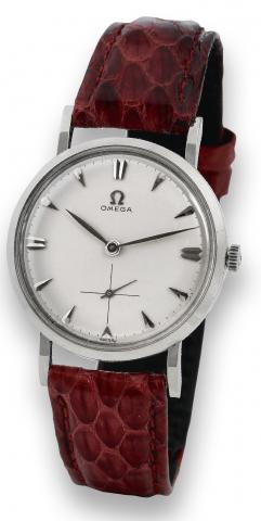 White Gold.Omega, No. 15864758, Ref. N 6555. Made in the.1960s..Fine and very rare, 14K white gold wristwatch with a stainless.steel Omega buckle.