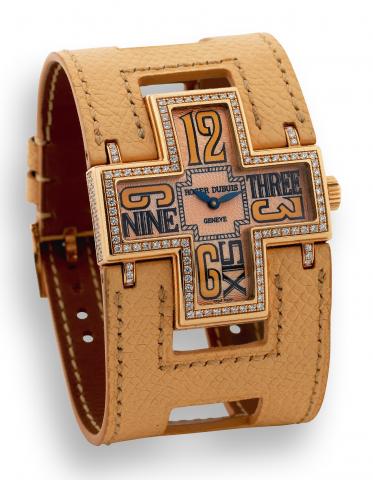 Pink Follow Me.Roger Dubuis, Horloger Genevois, Follow Me.No. 217/888, Ref. F17. Made in a limited edition of 888 pieces.in the early 2000s..Fine and unusual, cross-shaped and curved, water-resistant.18K pink gold and diamond quartz wristwatch with an 18K