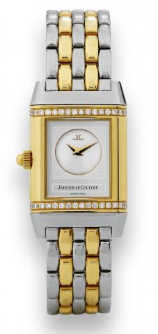 Duetto, Day and Evening.Jaeger-LeCoultre, Reverso Joaillerie, No. 266.5.44.case No. 2000951. Made circa 2000..Fine and elegant, rectangular, double-dial, stainless steel, 18K.yellow gold and diamond lady's reversible wristwatch with a.stainless steel and 