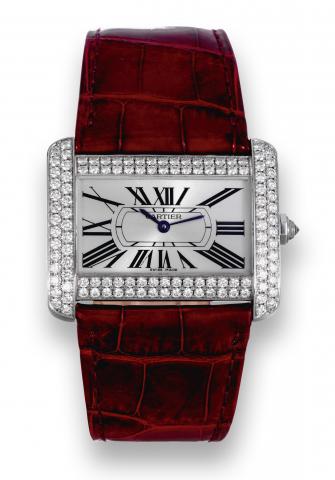 Tank Divan.Cartier, Tank Divan, case No. 284498CE, Ref. 2614..Made circa 2006..Fine and unusual, horizontal rectangular and curved, waterresistant.18K white gold and diamond-set quartz wristwatch.with an 18K white gold and diamond Cartier buckle. Accompan