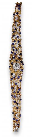 Diamond & Sapphire Rocaille.Piaget, movement No. 719687, case No. 208083, Ref. 3259. Made in the.1960's..Extremely fine, rare and elegant, 18K yellow gold, diamond and sapphire-set lady