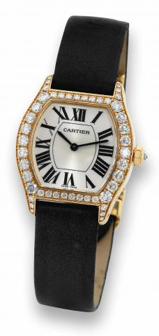 Cartier Tortue, Collection Priv_e.Cartier Tortue, No. 90974 LX, Ref. 2645. Made.circa 2005..Fine, tonneau-shaped, water-resistant, 18K yellow gold.and diamond wristwatch with an 18K yellow gold Cartier.deployant clasp..To be sold without reserve