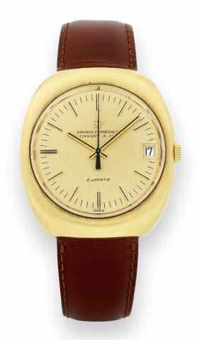 Gold Tonneau Quartz.Girard-Perregaux, Retailed by Tiffany & Co., No..126554, Ref. 9444. Made in the 1970s..Fine, water-resistant, center seconds, 18K yellow gold quartz.wristwatch with date..To be sold without reserve