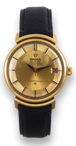Omega, Constellation, Automatic.Chronometer, Officially Certified.movement No. 24446460, case No..690030, Ref. 168002SC. Made in 1966..Fine, center seconds, water resistant.self-winding, 18K yellow gold wristwatch.with date..To be sold without reserve