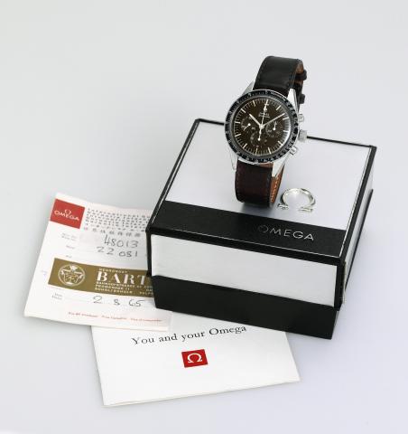 Pre-Moon, Chocolate Dial.Omega, Speedmaster, movement No. 22081571, Ref. ST 105.003-63. Made in 1964..Fine and rare, water-resistant, stainless steel wristwatch with round button chronograph, registers and tachometer..Accompanied by a Omega box and bookle