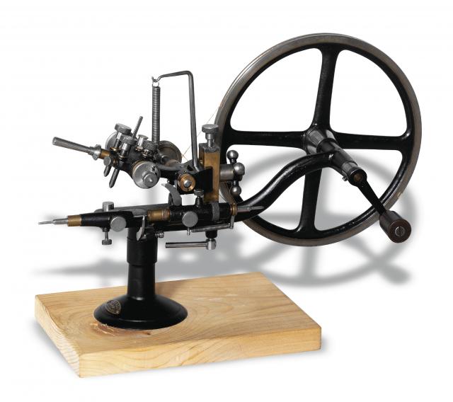 Rounding-Up Tool.Exa, retailed by Sandoz Fils & Co..La Chaux-de- Fonds & Bienne, Swiss. Made in.the 20th century..Fine, painted steel rounding-up tool on wooden.base..To be sold without reserve