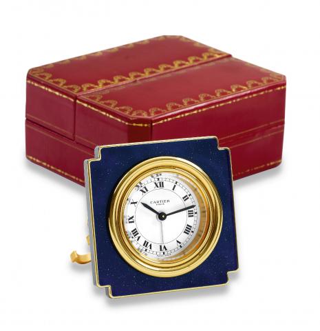 Cartier, Paris, Ref. 7512, No. 09019. Made circa.1980..Fine 8-day going lacquer and brass desk alarm clock. Accompanied.by the original instructions and a fitted box..To be sold without reserve