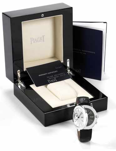 Piaget White Gold Altiplano Double Play.Piaget, Altiplano M_canique Double Jeu, case No. 968407, Ref. GOA 31152. Made.circa 2008..Very fine, rare and unusual, two time zone, two thin 18K white gold wristwatches back on.back with an 18K white gold Piaget d