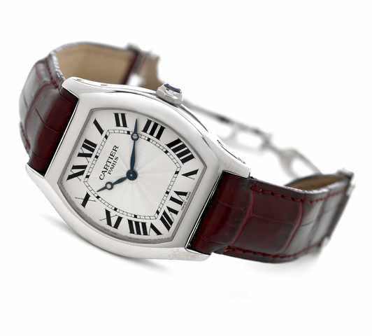 Cartier Platinum Cartier Tortue, Private Collection.Cartier Tortue, No. 0098 MG, Ref. 2518 E. Made circa 2003..Fine, tonneau-shaped, water-resistant, platinum wristwatch with an 18K white gold Cartier deployant clasp.