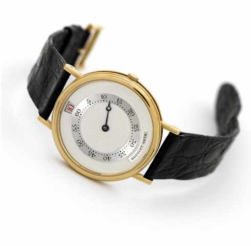 BREGUET SOUSCRIPTION NO.03.Breguet, No. 03/50, Ref. 4705. Produced in 1989 in a limited edition of 50 pieces..Very fine and rare, jump-hour, self-winding, 18K yellow gold wristwatch with 18K gold buckle.