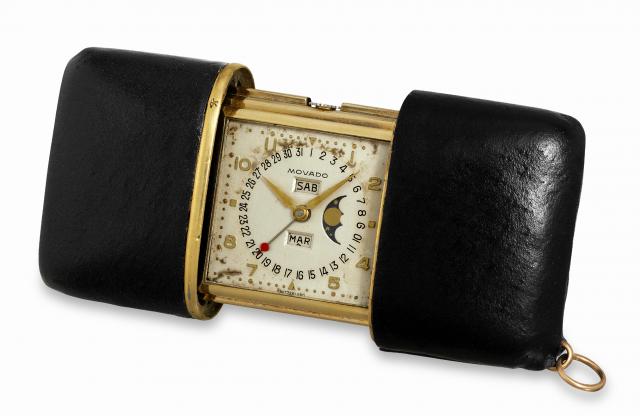 Movado Calendermeto.Movado, Swiss, Calendermeto, case No. 1249, Ref. 215M..Made in the 1950's..Fine, leather-covered, 18K yellow gold Ermeto purse watch.with triple date calendar and moon phases..To be sold without reserve