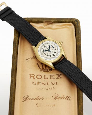 Rolex Ref. 2303, Single Button Chronograph.Rolex, Ref. 2303. Case No. 17890. Made in 1935, retailed by.Ronchi Milano..Very fine and extremely rare, small, 18K yellow gold wristwatch with.co-axial button chronograph, registers, tachometer and the original.