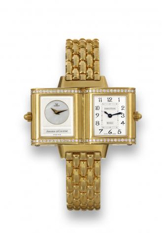 Jaeger-LeCoultre Reverso Duetto.Joaillerie.Jaeger-LeCoultre, Reverso Duetto Joaillerie, No. 2037011.Ref. 266.112.005. Sold on March 20, 2002..Fine and elegant, rectangular, 18K yellow gold and diamond.lady's reversible double-dial wristwatch with an 18K y