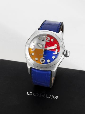 Corum Bubble Automatic.Corum, Bubble Automatic, case No. 772568.Ref. 82.150.20. Made in the 1990s..Fine and unusual, large and curved, self-winding, water.resistant, stainless steel wristwatch with center-seconds, date.thick domed crystal creating a lens 