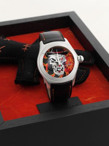 Corum Baron Samedi.Corum, Collector Series 2006, No. 535/777, case No..1750911, Ref. 082.120.20. Made in a limited series of 777.examples in 2006, sold on May 1st, 2008..Fine and unusual, large and curved, center seconds, selfwinding.water-resistant stain
