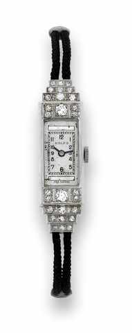 Rolex Princess Egyptian.Rolex, Princess Egyptian, case No. F 530, Ref. 1466. Made.in the 1930's..Fine and rare, rectangular curved, 18K white gold and.diamond lady's wristwatch with a black cord bracelet.