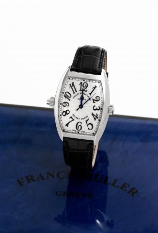 Franck Muller Secret Ho urs.Franck Muller, Geneve, Master of Complications, Secret.Hours, No. 29, Ref. 7880 SE H I. Made circa 2007..Very fine and unusual, large, curved tonneau-shaped.self-winding, water-resistant, 18K white gold wristwatch with.two crow