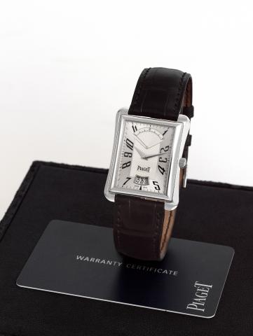 Piaget White Go ld.Emperador Retrograde.Seconds.Piaget, Emperador, case No. 912954.Ref. P 10108. Sold on February 7, 2004..Fine, rectangular flared, water-resistant.self-winding, 18K white gold wristwatch.with retrograde seconds, date and.an 18K white gol