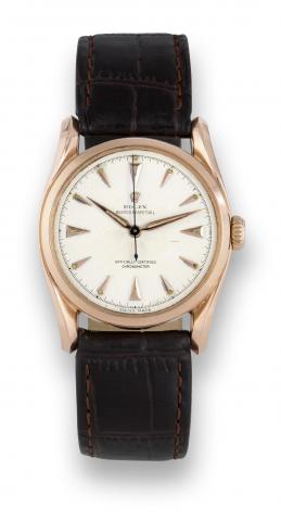 Rolex Pink Gold Bombay.Rolex,Oyster Perpetual, Officially.Certified Chronometer, case No..681376, Ref. 6018. Made in 1950..Fine and rare, center seconds, selfwinding.water-resistant, tonneaushaped.18K pink gold wristwatch with.Super Oyster Crown.