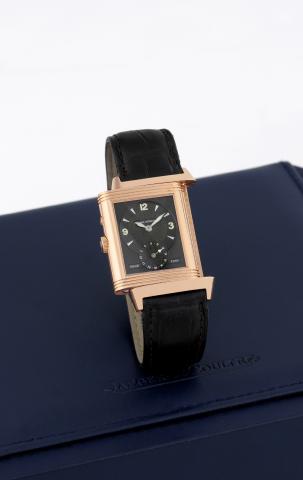 Jaeger LeCoultre Night/Day pink gold.Jaeger-LeCoultre, Reverso Duo Face, Night and Day, case.No. 1889069, Ref. 270.240.544. Sold on July 19th, 1998..Very fine, rectangular, two time zone, day/night indication.double-face, 18K pink gold wristwatch and an 1