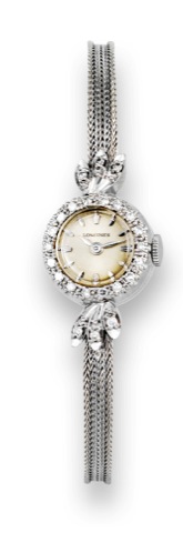 Longines, movement.No. 11752113, case No. 52062.Ref. 8042. Made in the 1940s..Fine, 14K white gold and diamond lady's.wristwatch with an integral 14K white.linen-textured bracelet..To be sold without reserve